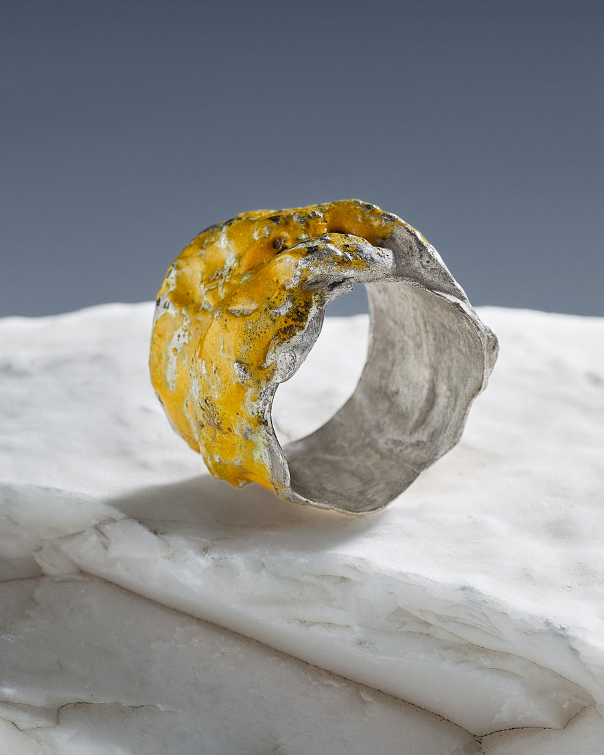 sterling silver ring enhanced with yellow enamel