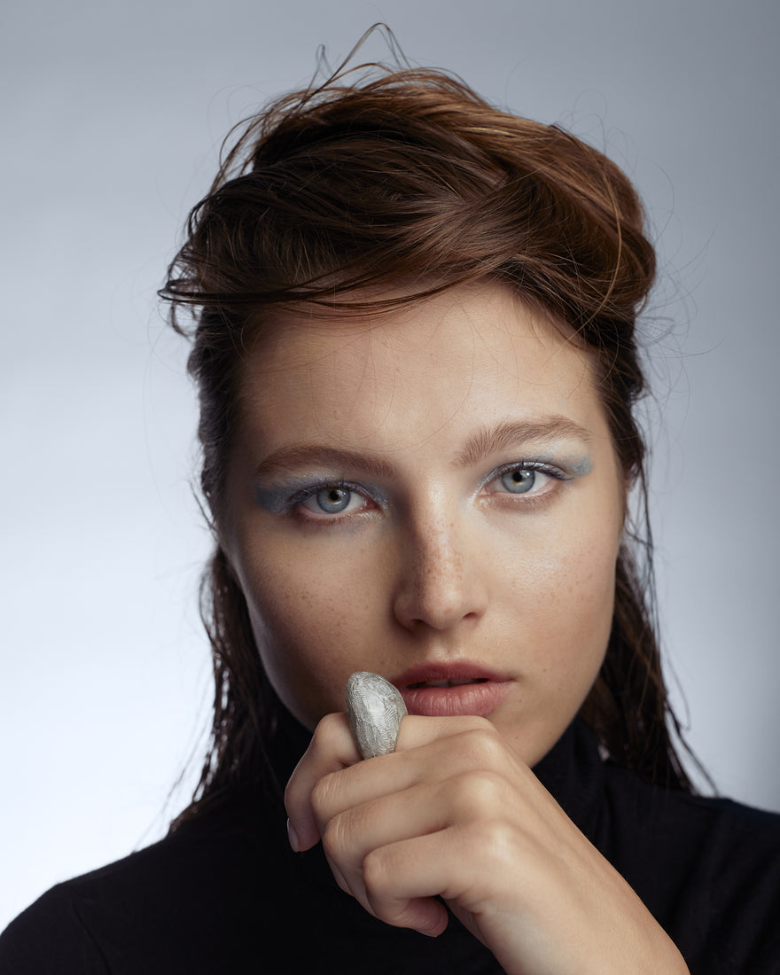Silver etched ring on model's hand