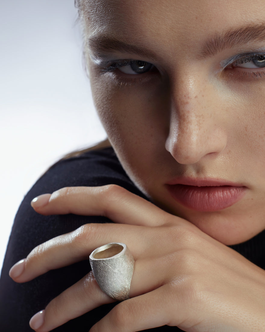 unique silver bombe ring on hand