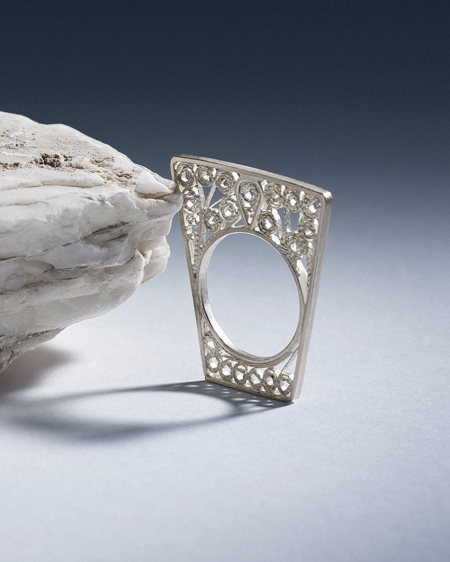 silver filigree ring with geometric design